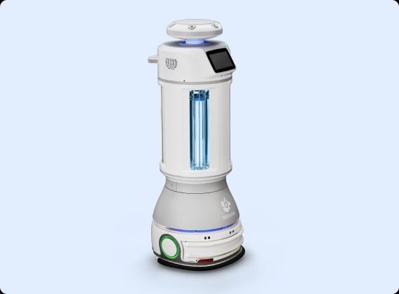 White and gray cylindrical disinfection robot with a blue UV light, used in a medical setting.