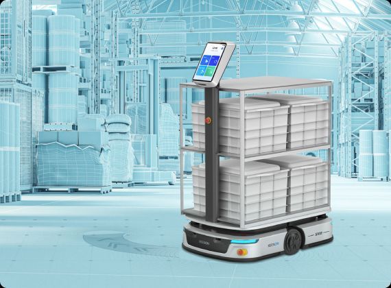 An autonomous mobile robot in a warehouse carries bins, with a control screen, against a blue-toned background.