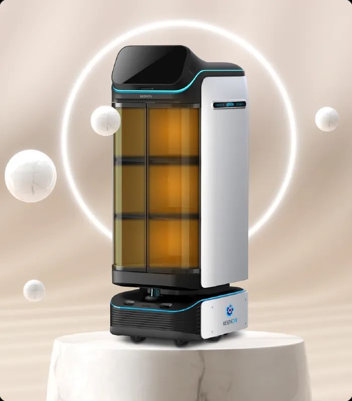 Robot delivery device, black and white, with transparent compartments holding items. On a pedestal.