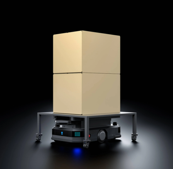 Robot carrying two stacked cardboard boxes on a dark reflective surface.