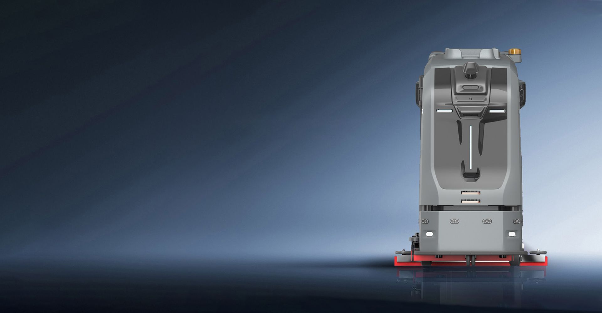 Portable oxygen concentrator on reflective surface. Gray and white with a black handle.