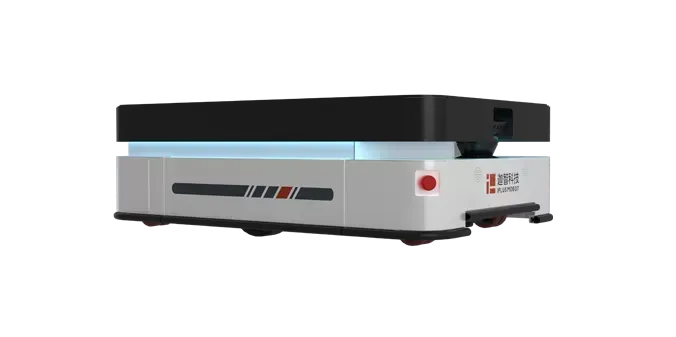 Person in hardhat pushing a robotic cart with a box in a warehouse aisle.