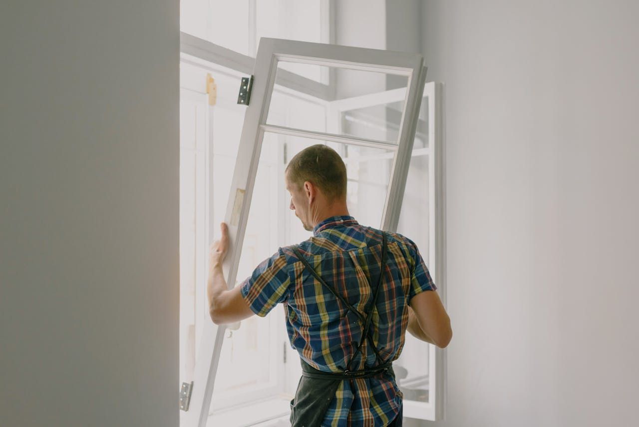 man making rental property improvements