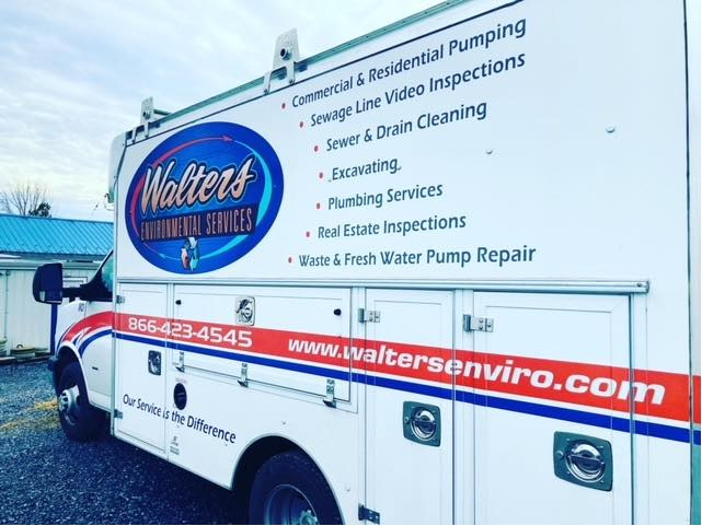 A white truck with the word walters on the side