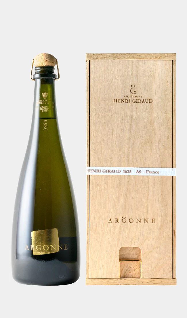 A bottle of champagne with a gold square on the label