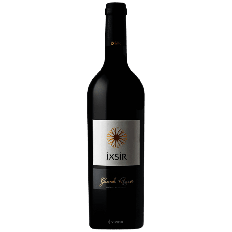 A bottle of ixsir red wine is on a white background.