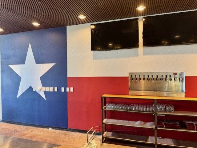 A red white and blue wall with a star on it