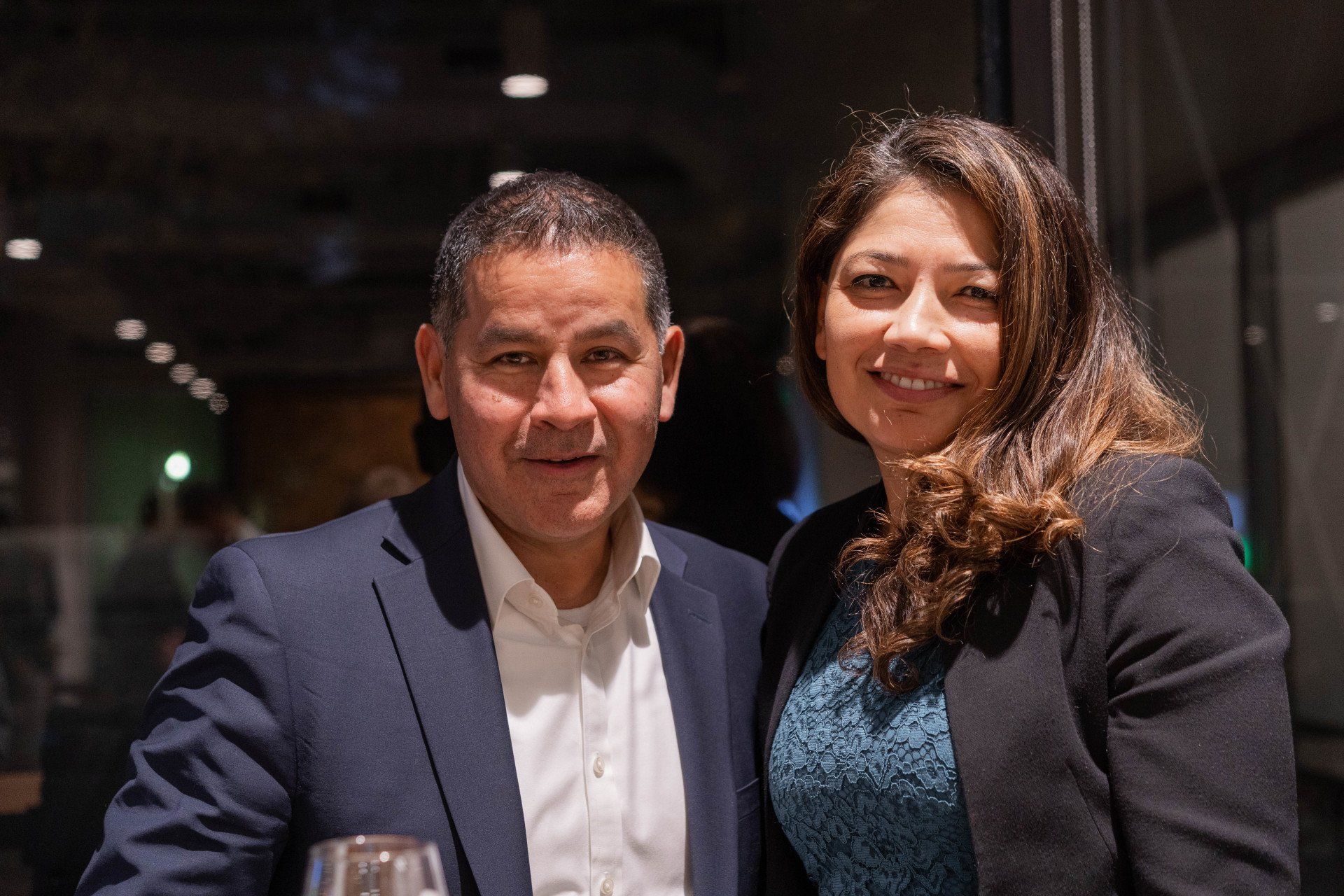 A man and a woman are posing for a picture together.