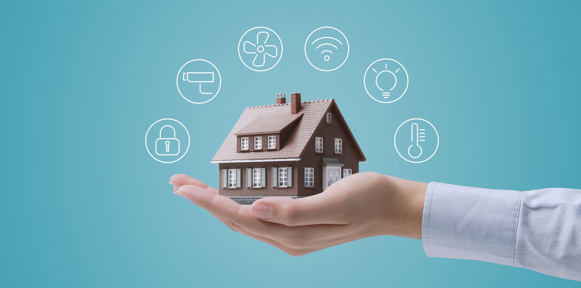 Hand holding house model with smart icons representing tech-driven property management solutions. Hand holding house model with smart icons representing tech-driven property management solutions.