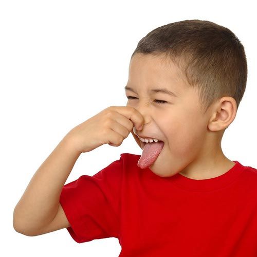 A child pinching their nose because of a bad smell