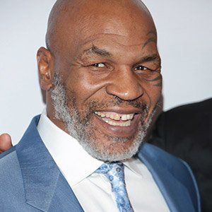 Mike Tyson showing of his smile after cosmetic procedure