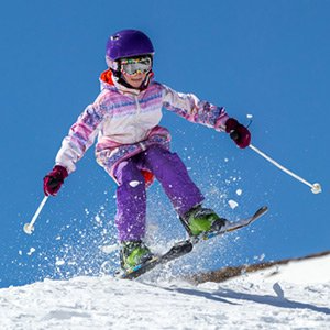 A person skiing down a snowy mountain