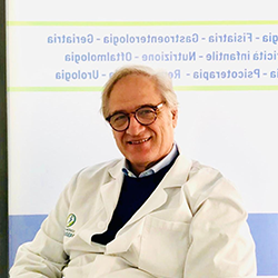 Logo del Centro Medico San Giuseppe: una figura all'interno di un cerchio blu e verde, con testo sottostante.