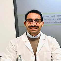 Logo del Centro Medico San Giuseppe: una figura all'interno di un cerchio blu e verde, con testo sottostante.