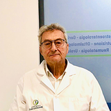 Logo del Centro Medico San Giuseppe: una figura all'interno di un cerchio blu e verde, con testo sottostante.