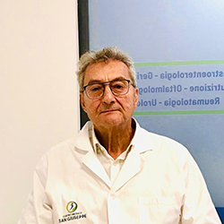 Logo del Centro Medico San Giuseppe: una figura all'interno di un cerchio blu e verde, con testo sottostante.