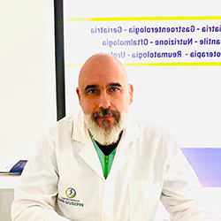 Logo del Centro Medico San Giuseppe: una figura all'interno di un cerchio blu e verde, con testo sottostante.