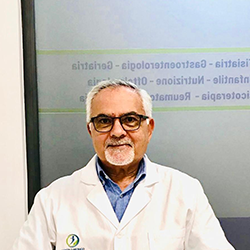 Logo del Centro Medico San Giuseppe: una figura all'interno di un cerchio blu e verde, con testo sottostante.