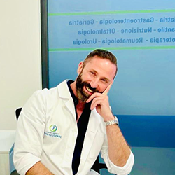 Logo del Centro Medico San Giuseppe: una figura all'interno di un cerchio blu e verde, con testo sottostante.