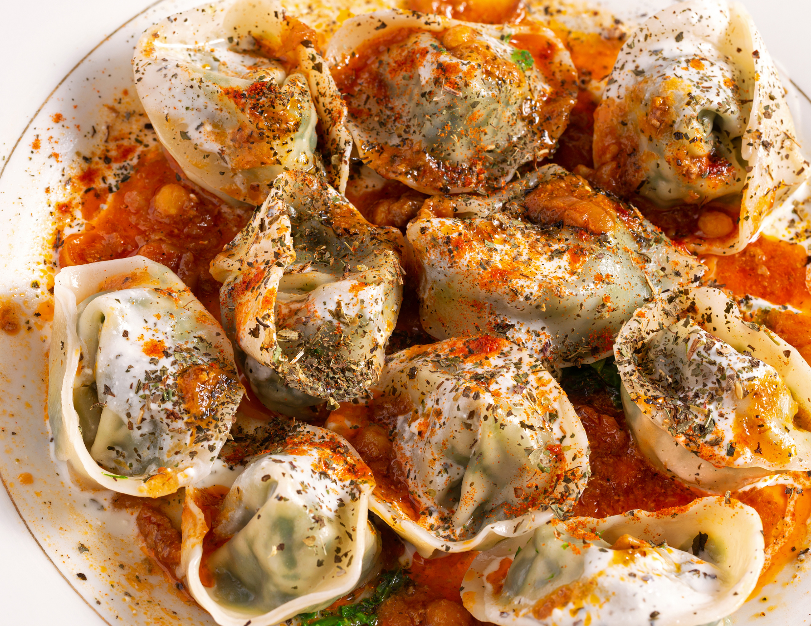 A close up of a plate of food with a sauce on it