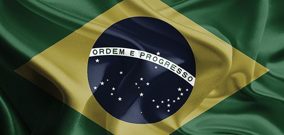 Bandeira brasileira com fundo verde e amarelo, com um círculo azul no centro.