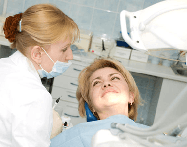 A patient chatting with her dentist