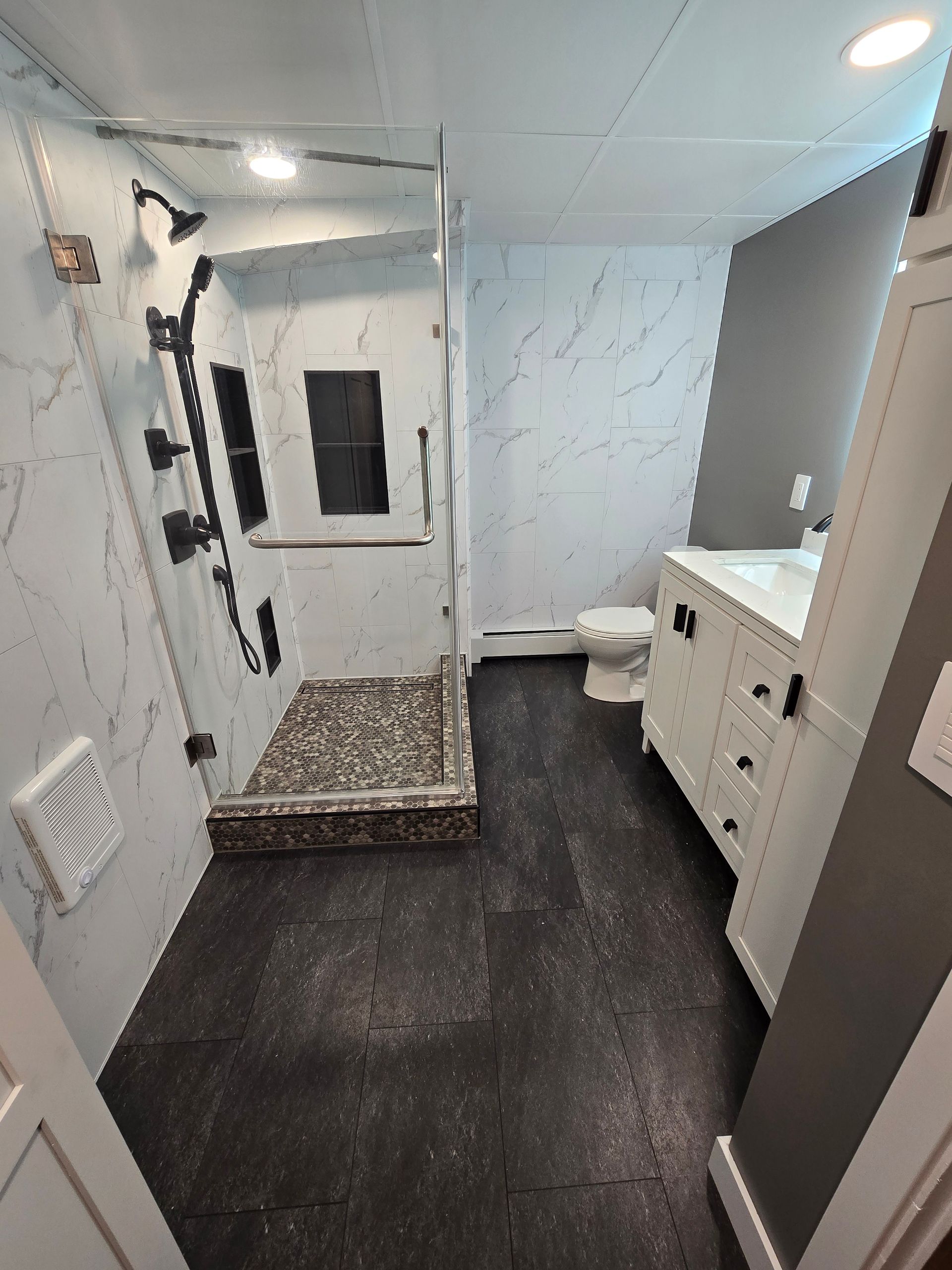 A before and after picture of a shower remodel.