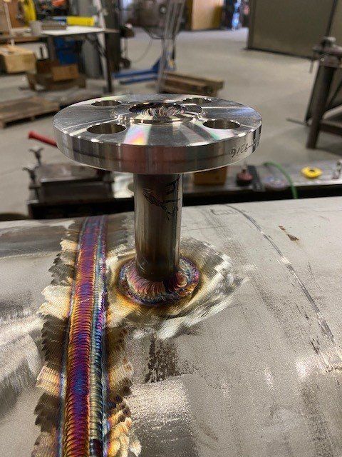 A piece of metal with a flange on top of it.