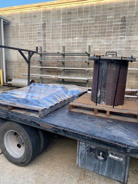 A truck is sitting on top of a wooden pallet.