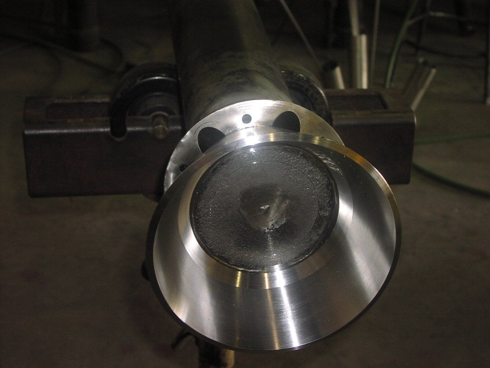 A close up of a metal object with a hole in the middle