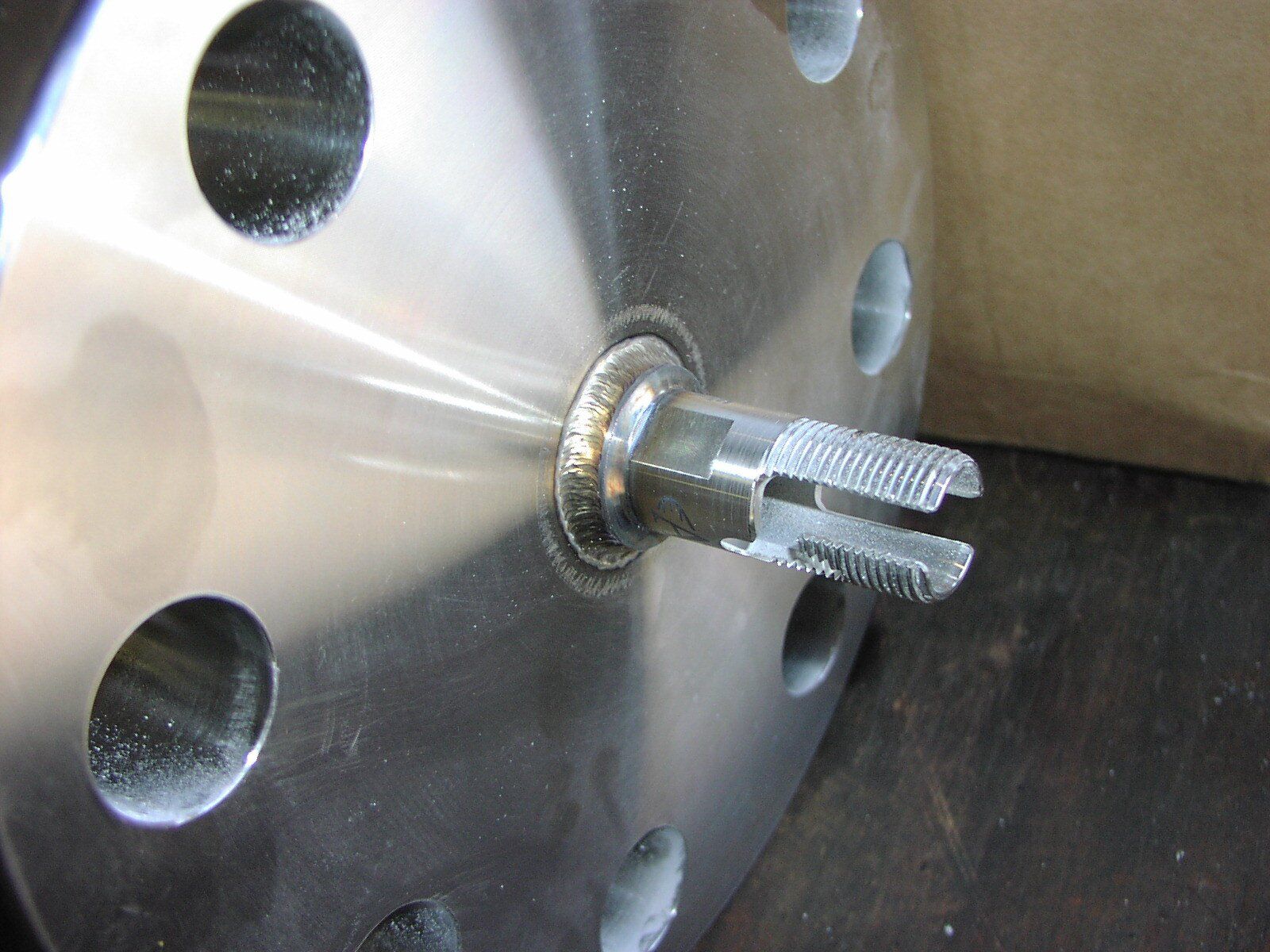 A close up of a metal object with holes in it