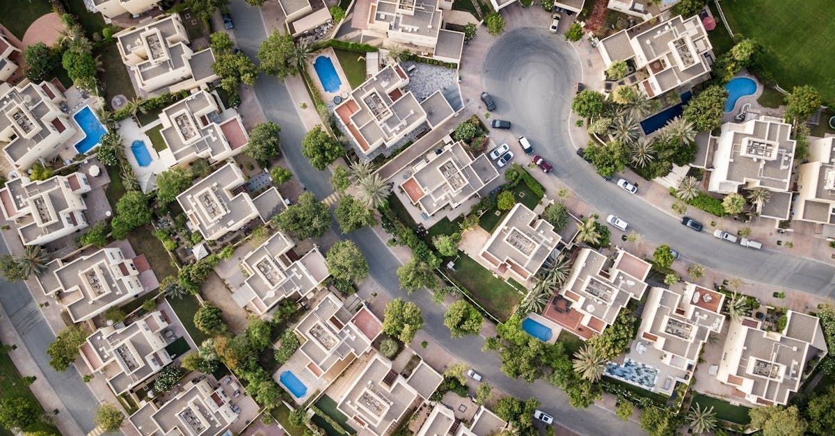 An aerial view of a residential area with lots of houses and trees.