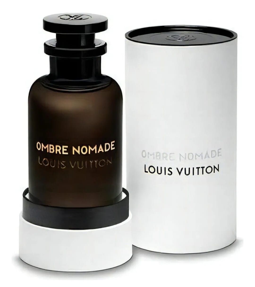 Frasco de perfume Louis Vuitton Ombre Nomade en caja cilíndrica blanca; frasco marrón, tapón negro.