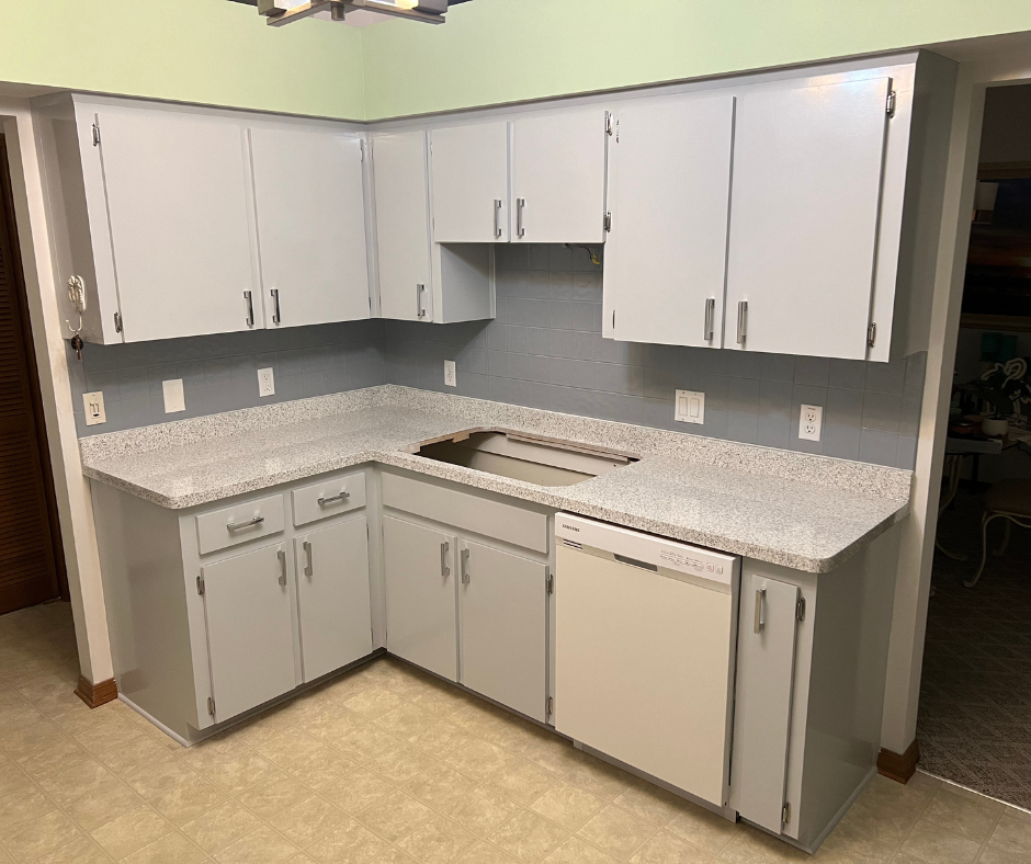 A Kitchen with White Cabinets , a Sink , and A Dishwasher — Inverness, FL — First Class Refinishing 