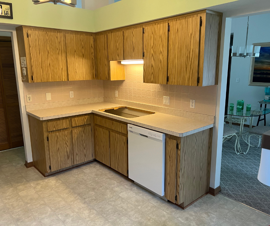 A Kitchen with Wooden Cabinets and A White Dishwasher — Inverness, FL — First Class Refinishing 