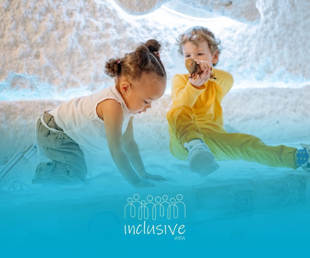 Two children playing in a white, textured environment, one looking down, one holding an object, with