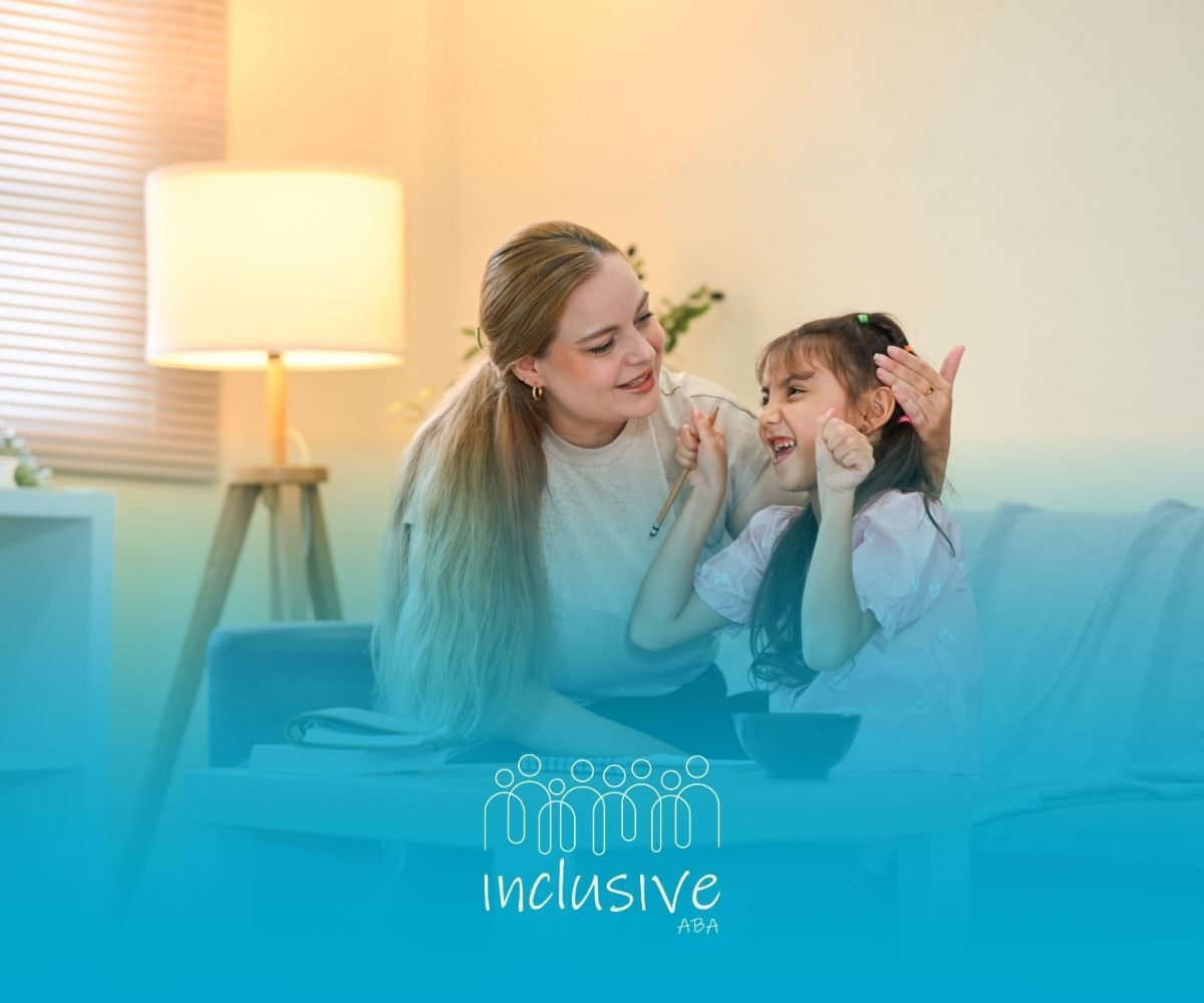 Woman and child on a couch, lit by a lamp. The child is smiling and making a face. 