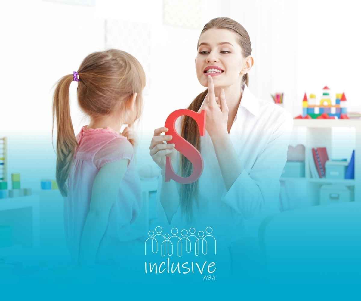 A speech therapist teaches a young girl the 