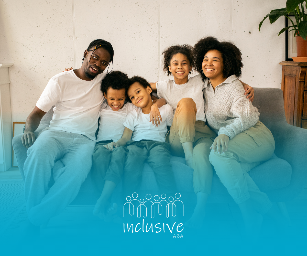 A family is posing for a picture while sitting on a couch.