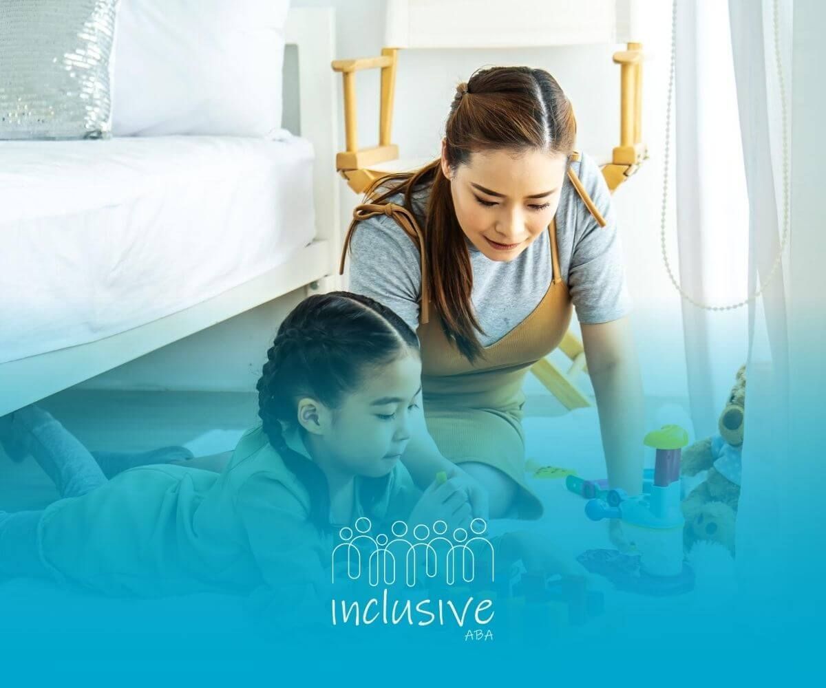 ABA therapist and autistic girl lying on floor playing with wooden block puzzle in ABA therapy.