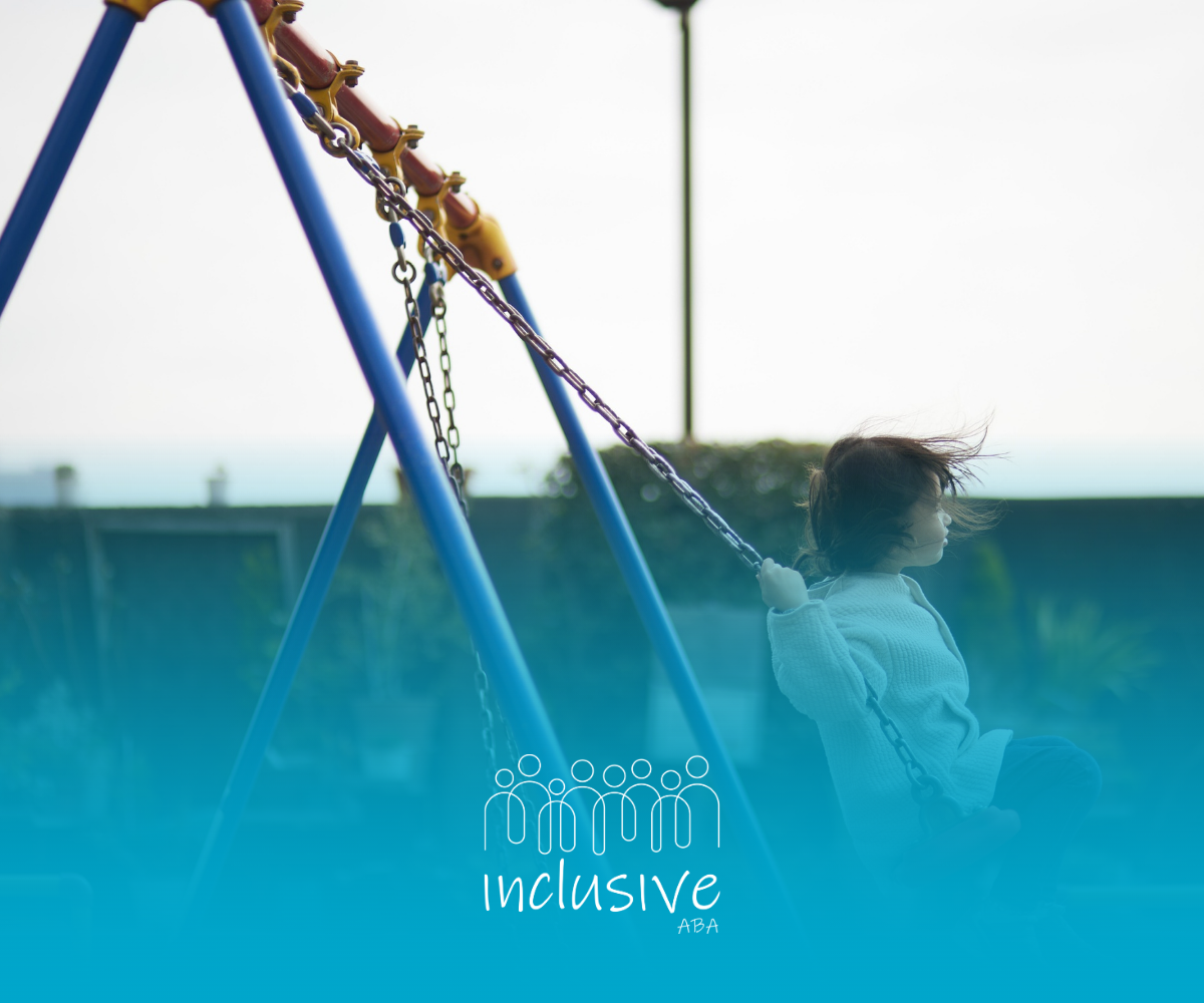 Child swinging on playground, blue swing set, white shirt, blue sky.