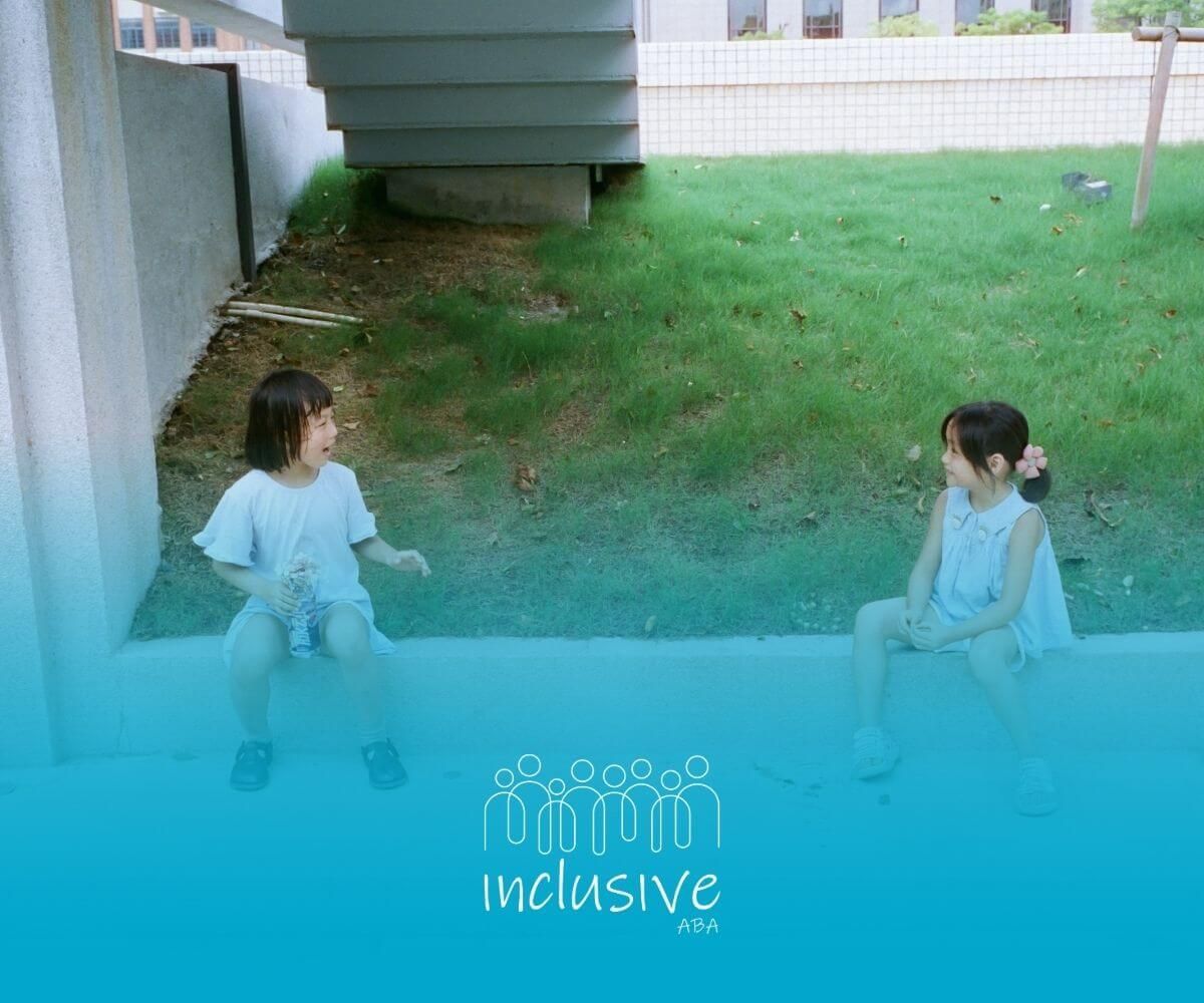 ABA therapist talking to his autistic child, having a serious conversation outdoors after therapy.