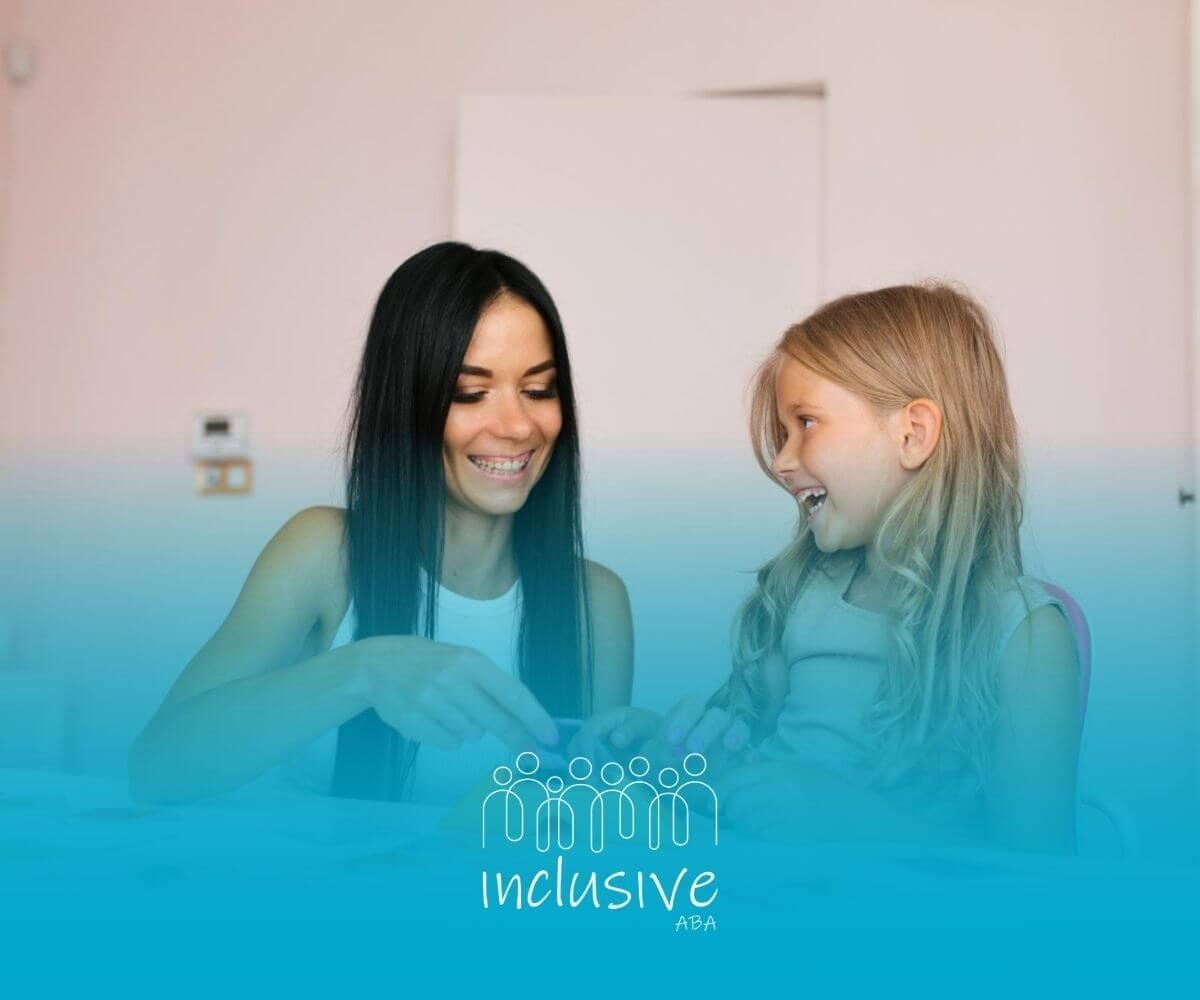 ABA therapist and autistic girl playing educational card game together at a desk in ABA therapy.