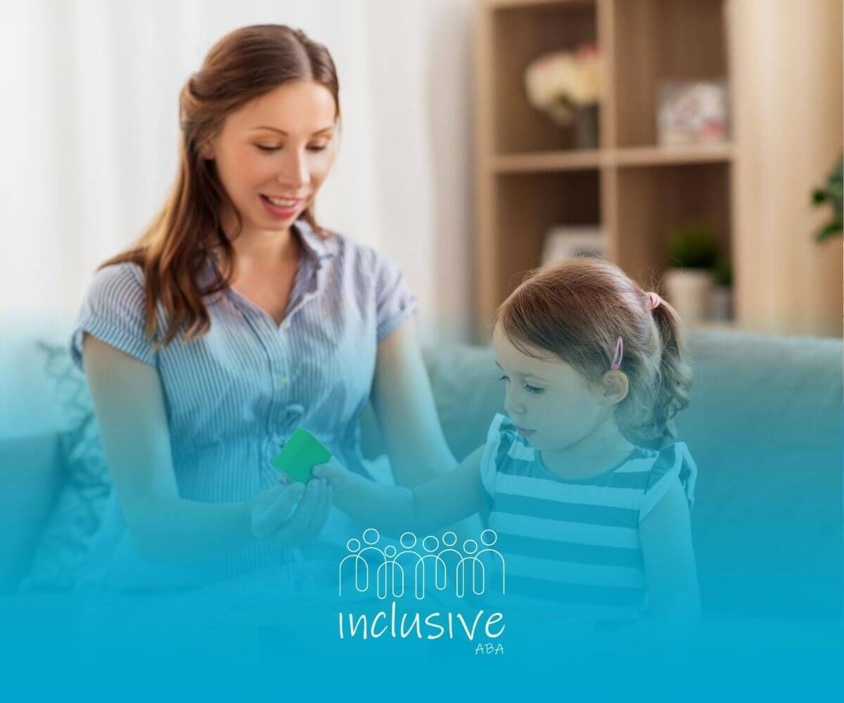 An ABA therapist and a little girl are playing with a wooden toy car in ABA therapy.
