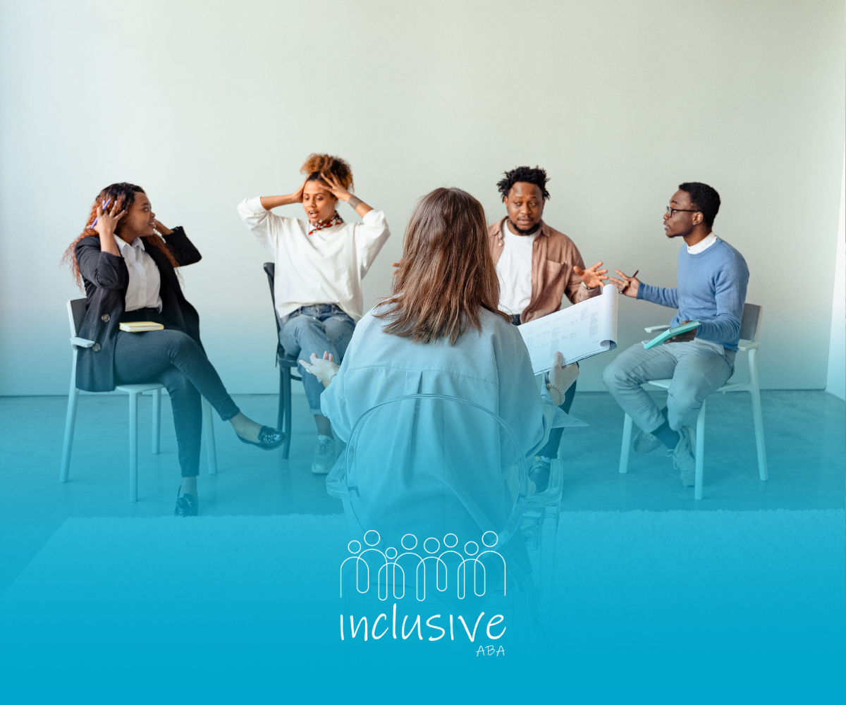 A group of people are sitting in a circle talking to each other.