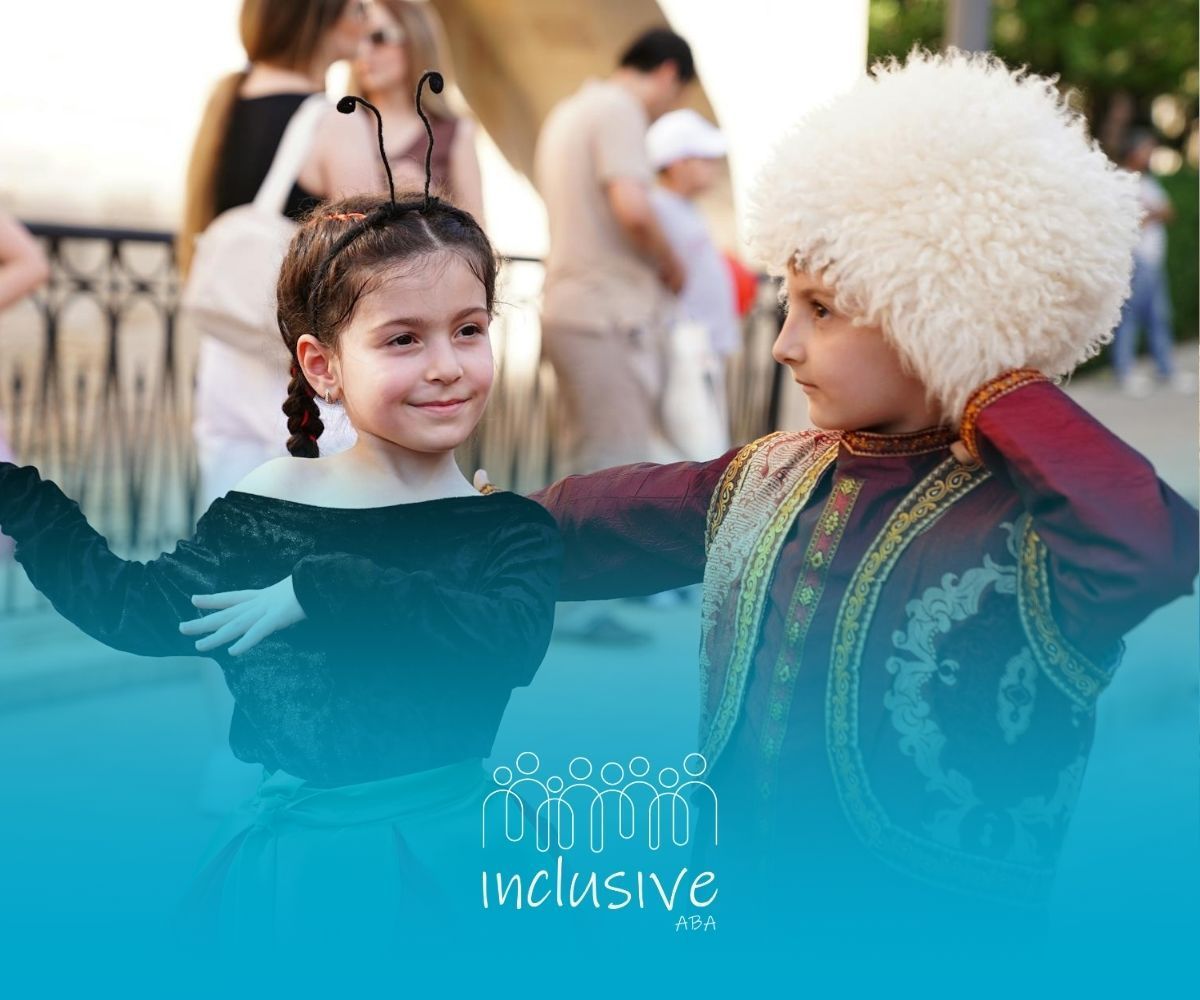 Two autistic children in costumes dancing outdoors during an ABA therapy session in Colorado.