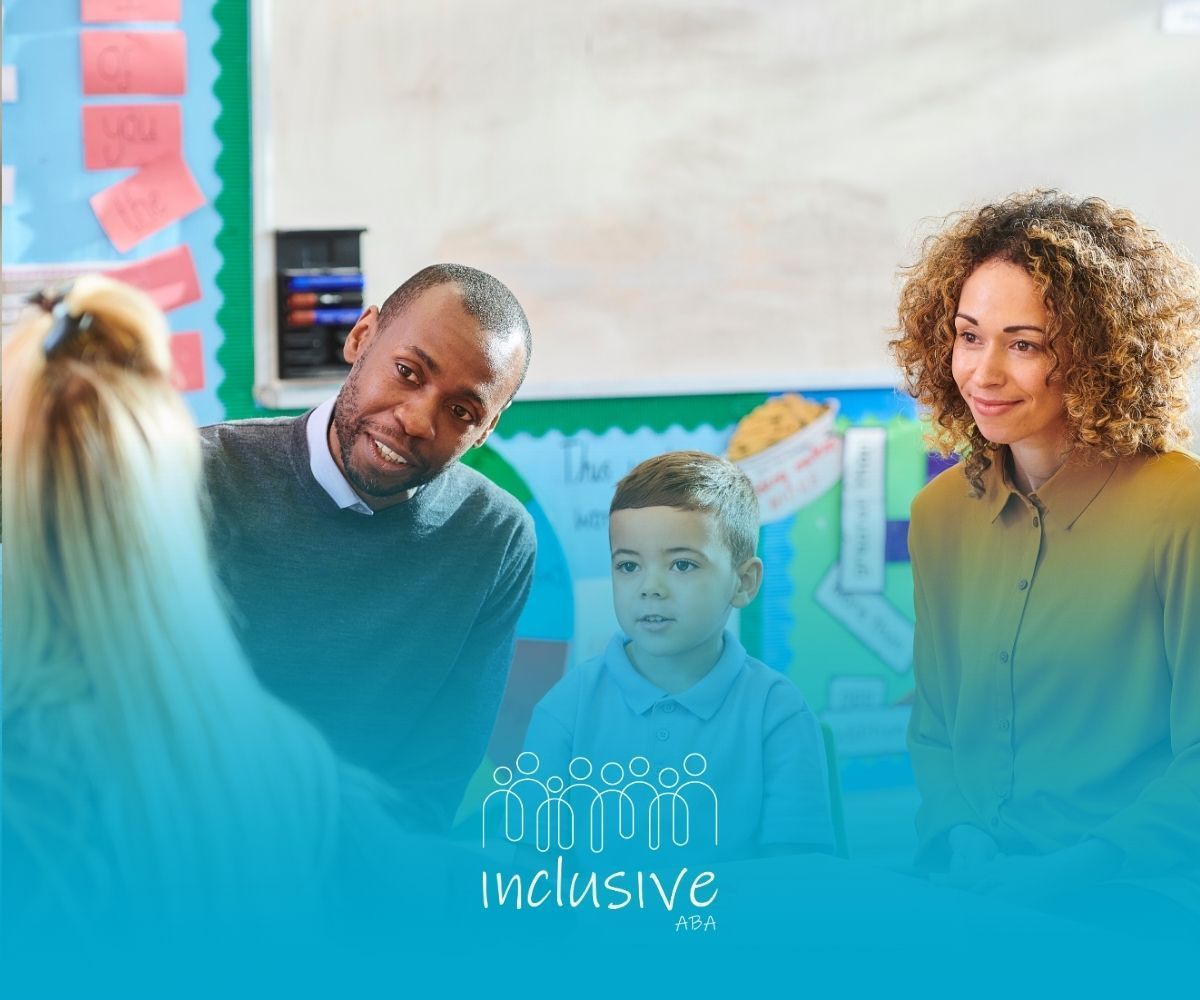 A teacher and two parents sitting with a student in a classroom, with the inclusive logo overlaid at the bottom.
