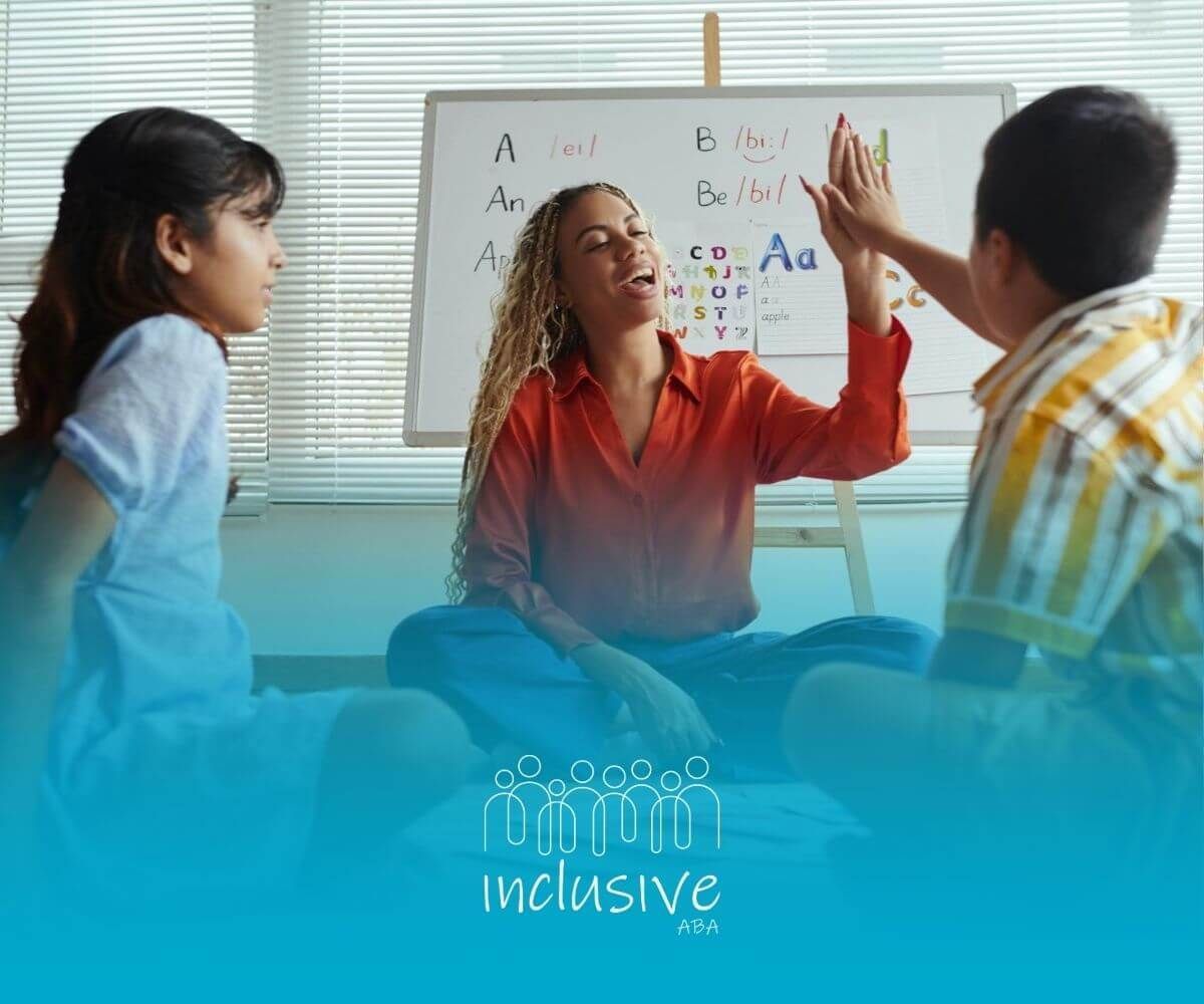 A BCBA is giving a high five to two children while sitting on the floor in ABA therapy.
