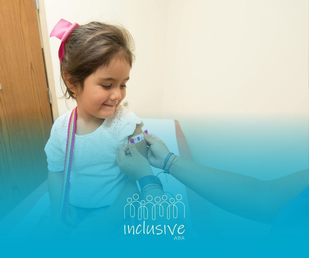 Nurse placing a bandage on a young autistic girl’s arm after a vaccination at a clinic in Colorado.