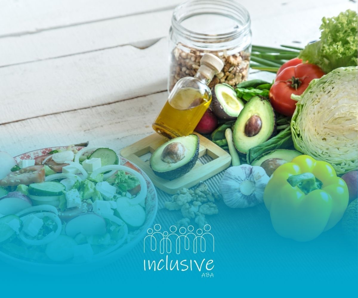 A table topped with a variety of vegetables and a bottle of olive oil.